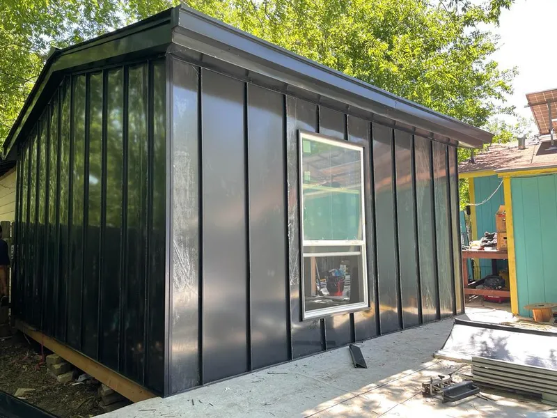 Black standing seam metal wall panels for Roof Inspection in Farmington Hills